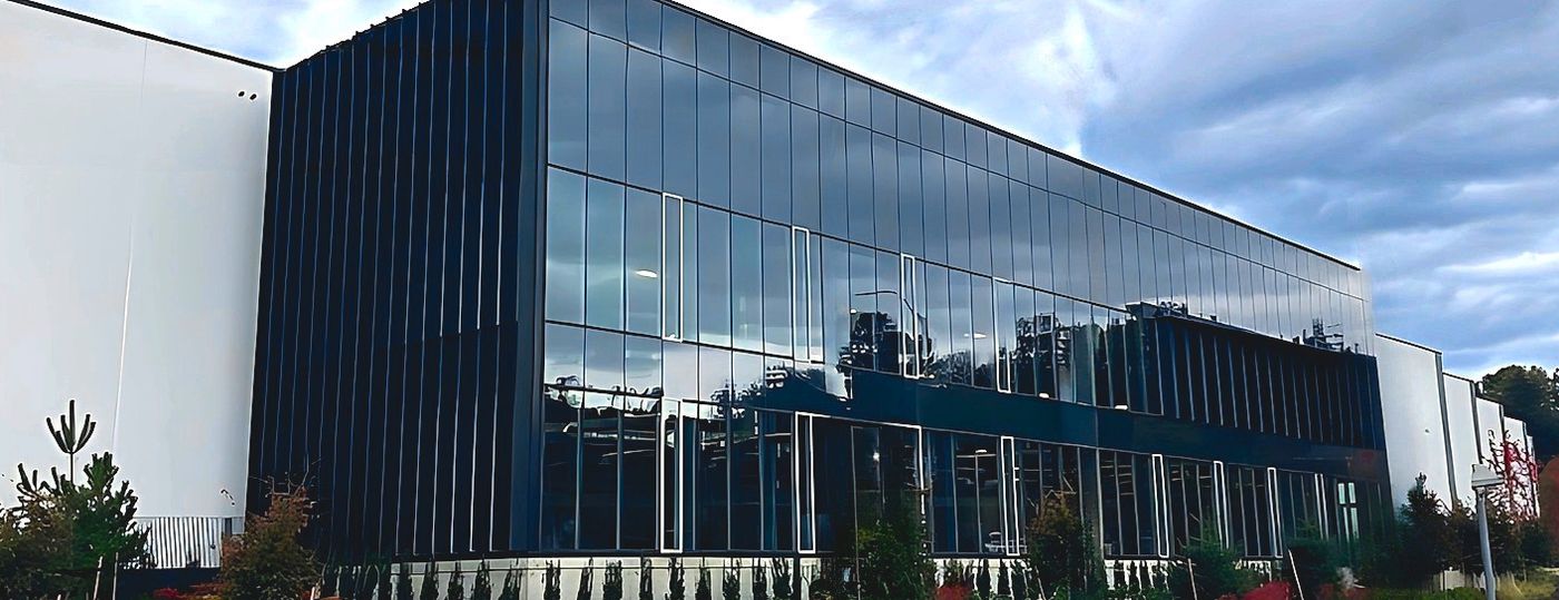 Bridgeview, Surrey. Metro Aluminum curtain wall across a two-storey commercial elevation.