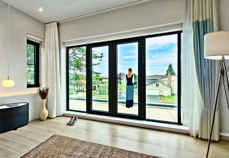Langton Road residence, Richmond. Reynaers French doors with twin fixed sidelites, seen from the living room.